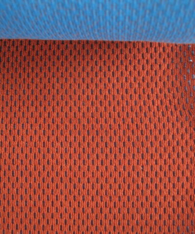 Kvadrat Febrik Plecto 564 roestbruin burnt orange blauw