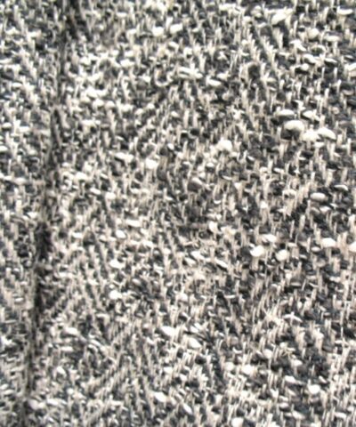 Bouclé meubelstof creme grijs