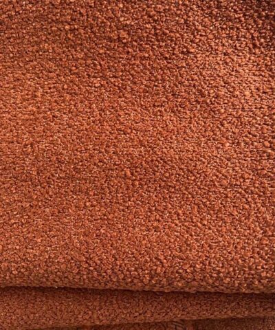 meubelstof bouclé burnt orange bruin oranje