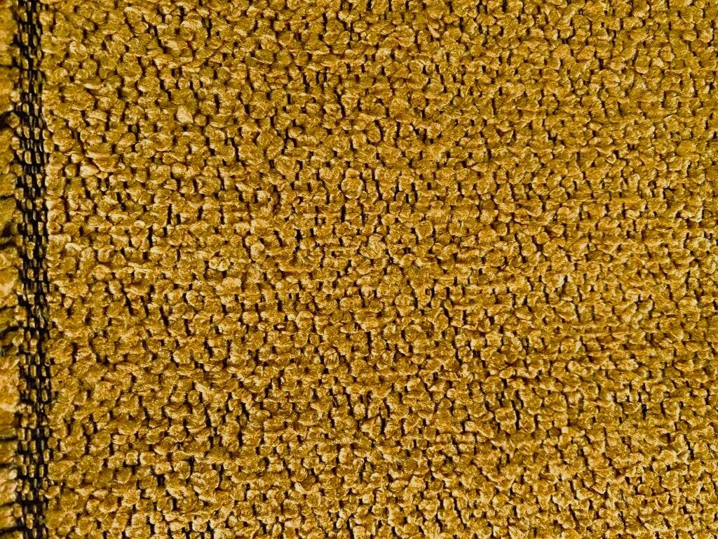 meubelstof bouclé oranje geel